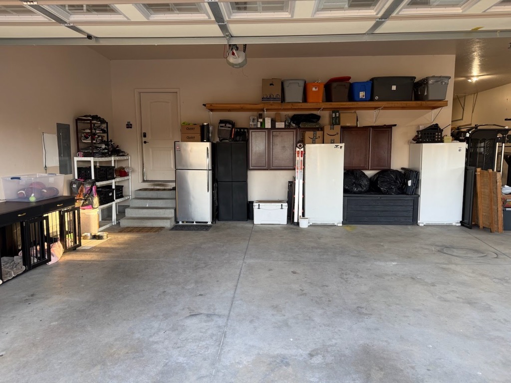 Professionally organized garage with custom shelving and storage bins
